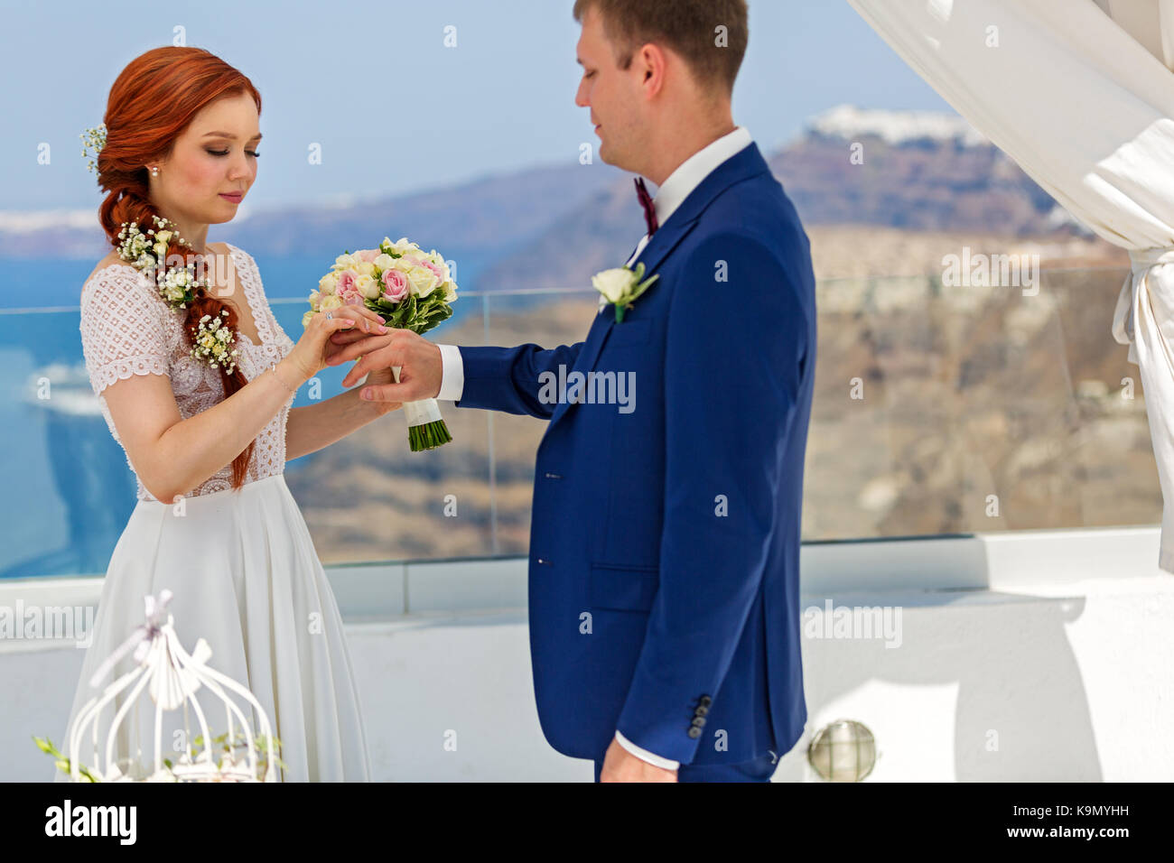 Wedding, the bride wears the ring for the groom Stock Photo Alamy