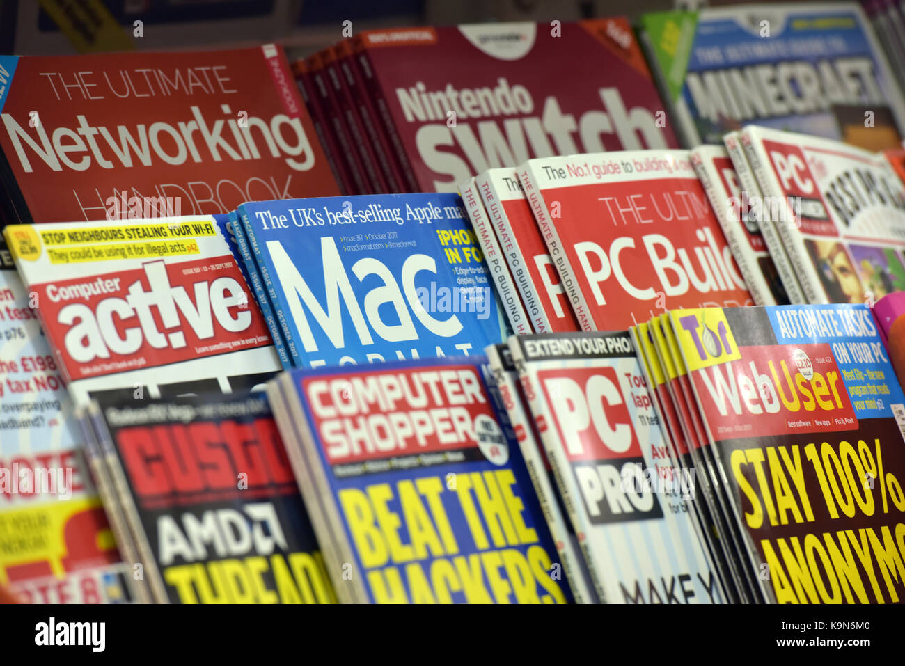 a selection of technical or technology magazines on sale at a newsagents store or shop computing interest and selling periodicals on tech and computer Stock Photo