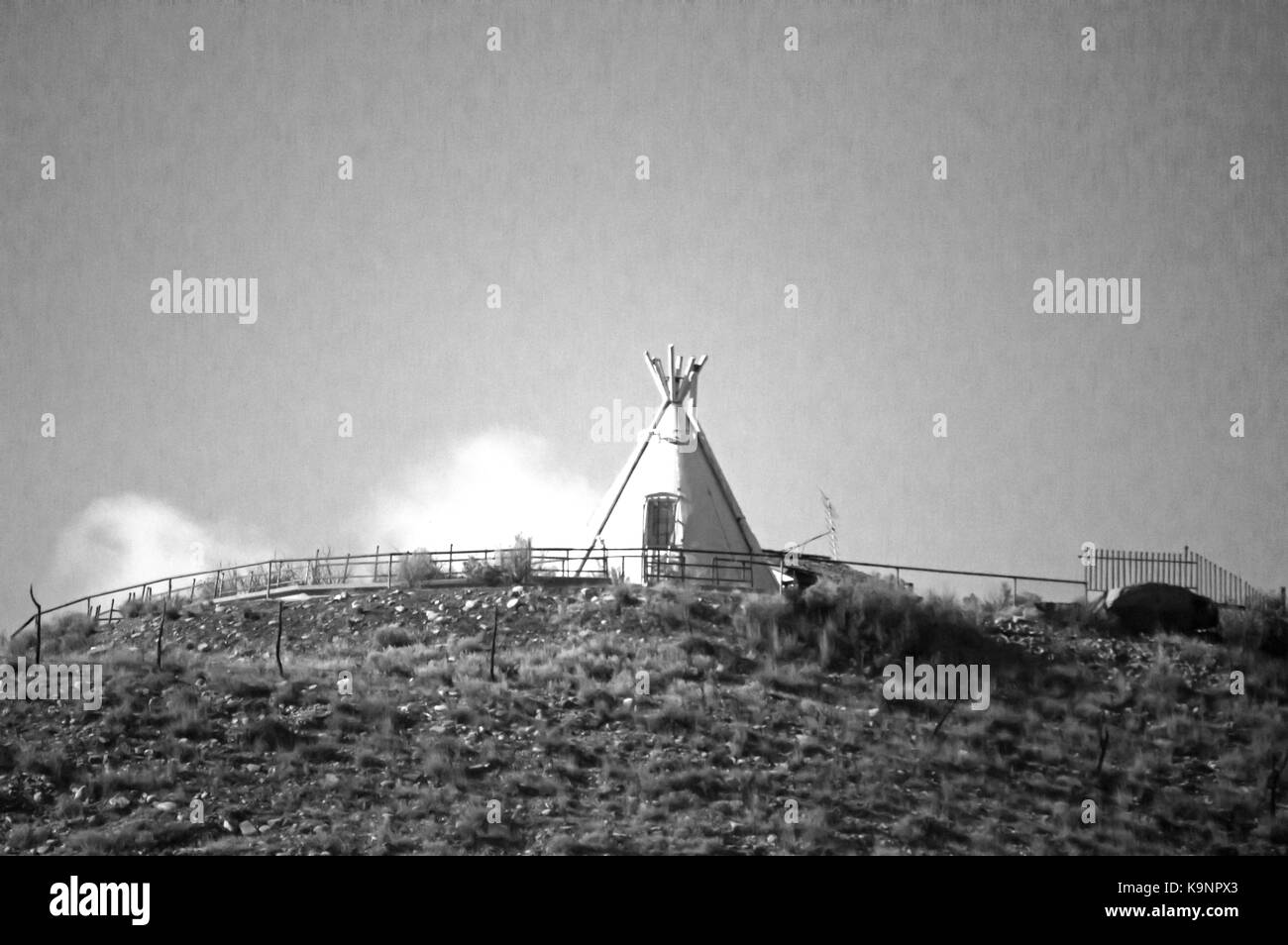 An old retro picture of an Indian tepee on a hill. Stock Photo