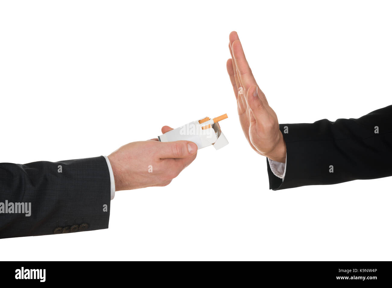 Businessman Refusing Cigarette Offered By His Colleague Stock Photo