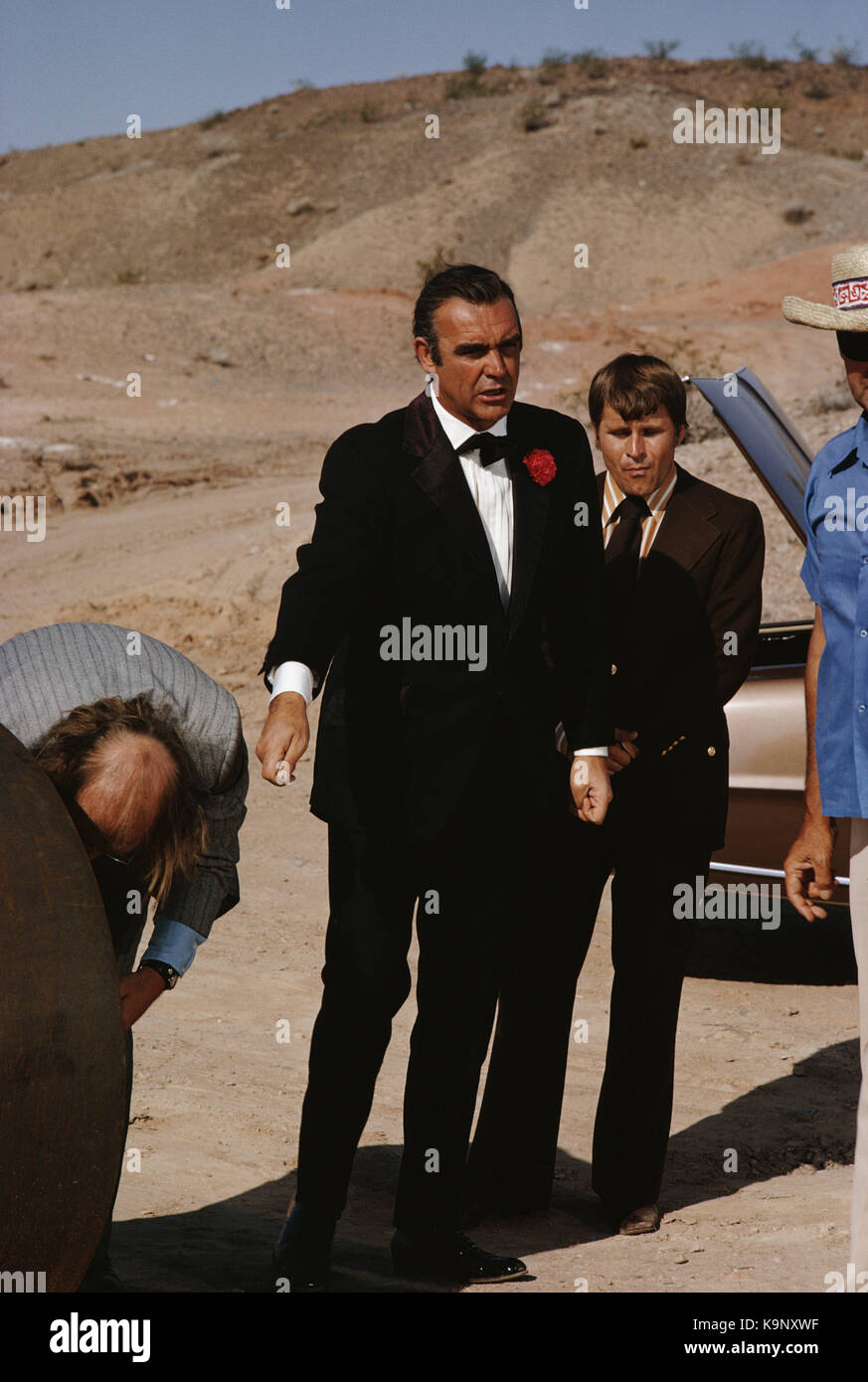 Scottish actor Sean Connery with actors Putter Smith (left) and Bruce Glover (right) on the set of the James Bond film 'Diamonds Are Forever', USA, Ma Stock Photo