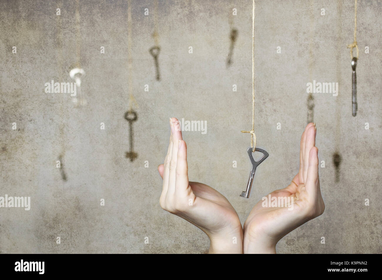 hand stretching for one of the many old vintage keys Stock Photo - Alamy