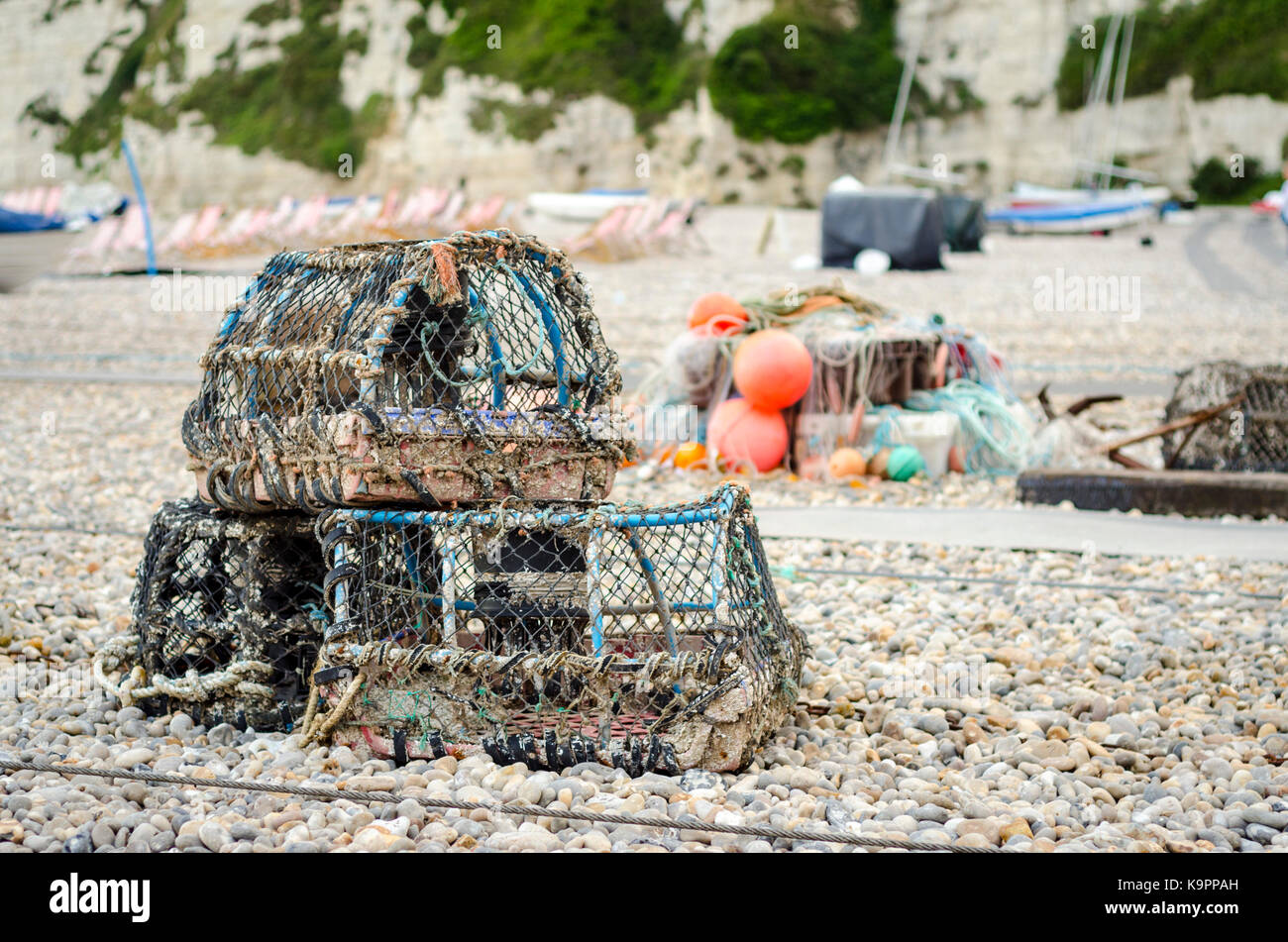 Fishing equipment lobster pots and crab boxes on the beach in Beer, Devon, England Stock Photo