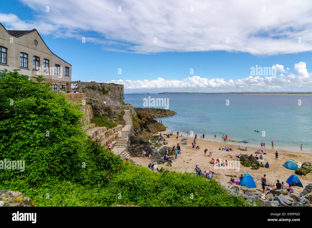 Looking down onto Bamaluz Beach busy with people, St Ives, Cornwall, Stock Photo