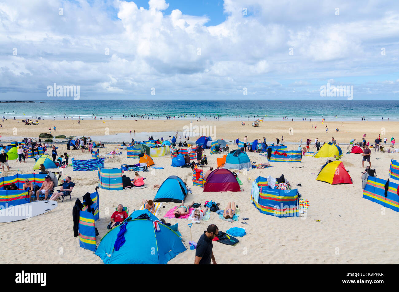People with tents on sandy Porthmeor beach, St Ives, Cornwall Stock Photo