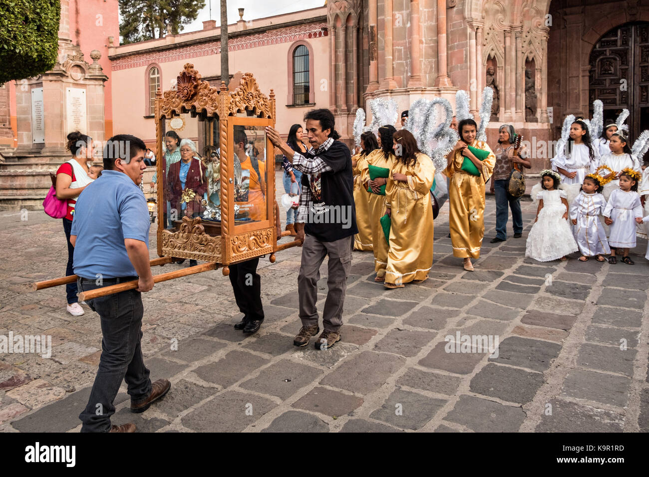 Local residents carry the statue of Saint Michael from the Parroquia de San Miguel Arcangel church at the start of the week long fiesta of the patron saint September 21, 2017 in San Miguel de Allende, Mexico. Stock Photo