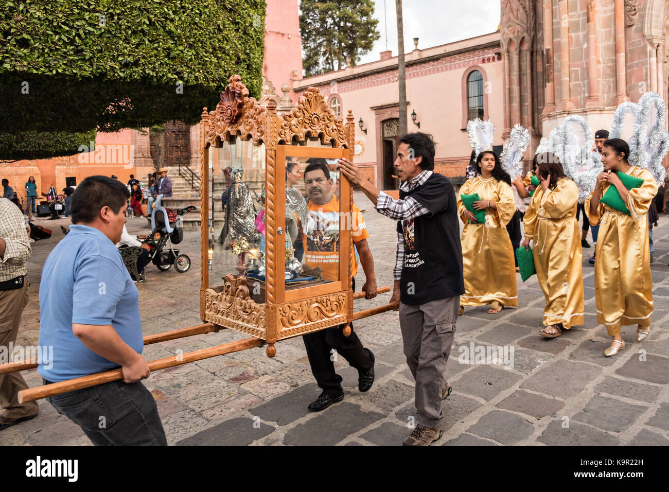 Local residents carry the statue of Saint Michael from the Parroquia de San Miguel Arcangel church at the start of the week long fiesta of the patron saint September 21, 2017 in San Miguel de Allende, Mexico. Stock Photo