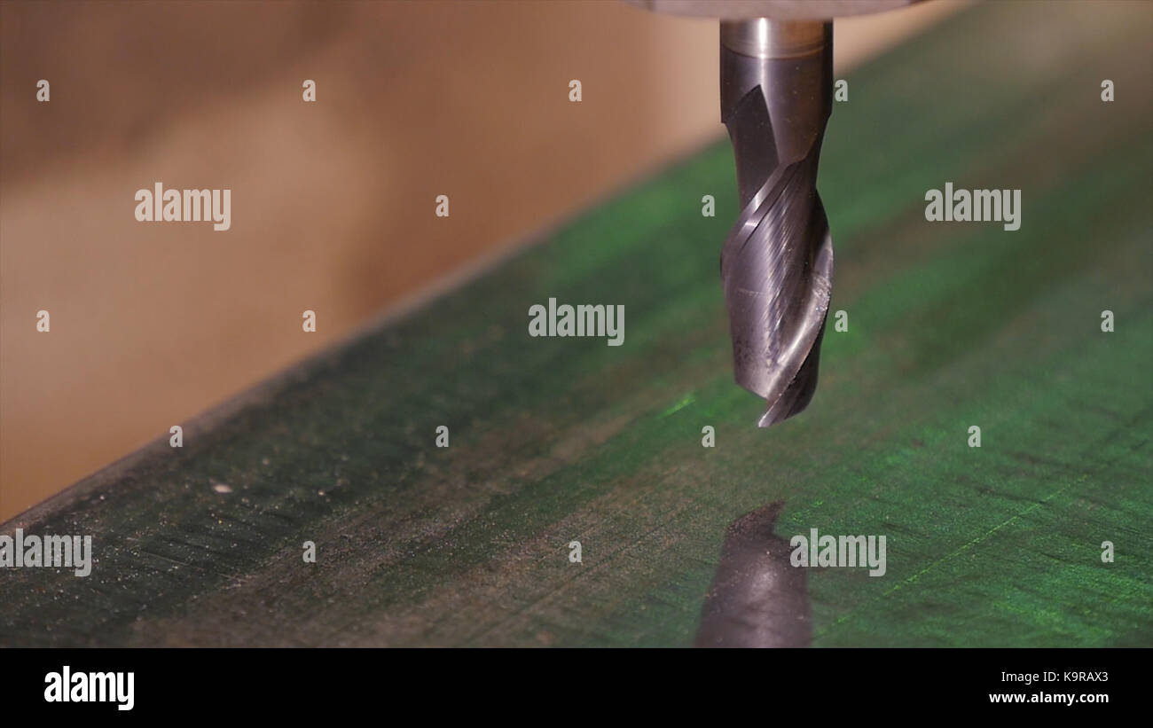 Hole being drilled into metal. Drilling closeup in metal