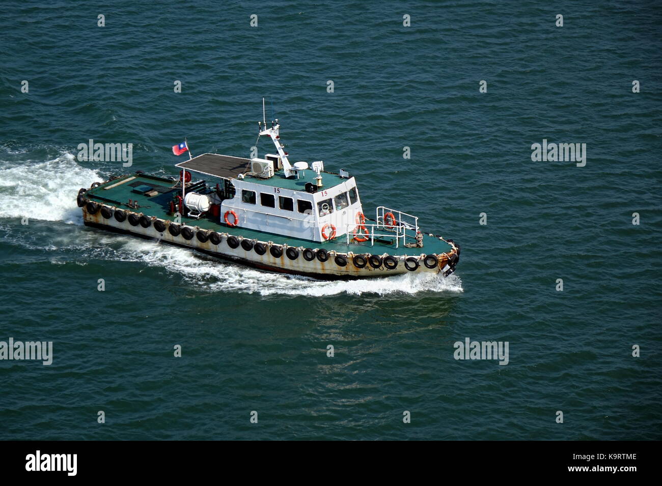 Tug boat guiding ship hi-res stock photography and images - Alamy