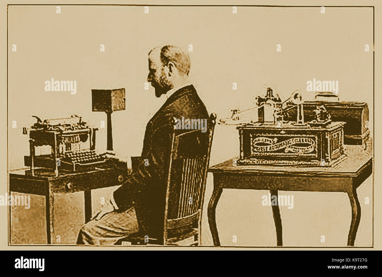 1897 - Telegraphy -  A man using a self teaching kit and learning how to operate the new technological invention of the telegraph using a Remington keyboard Stock Photo