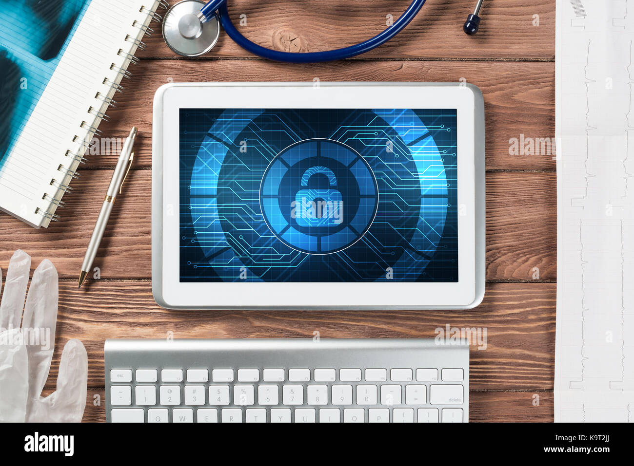 Web security and technology concept with tablet pc on wooden table ...