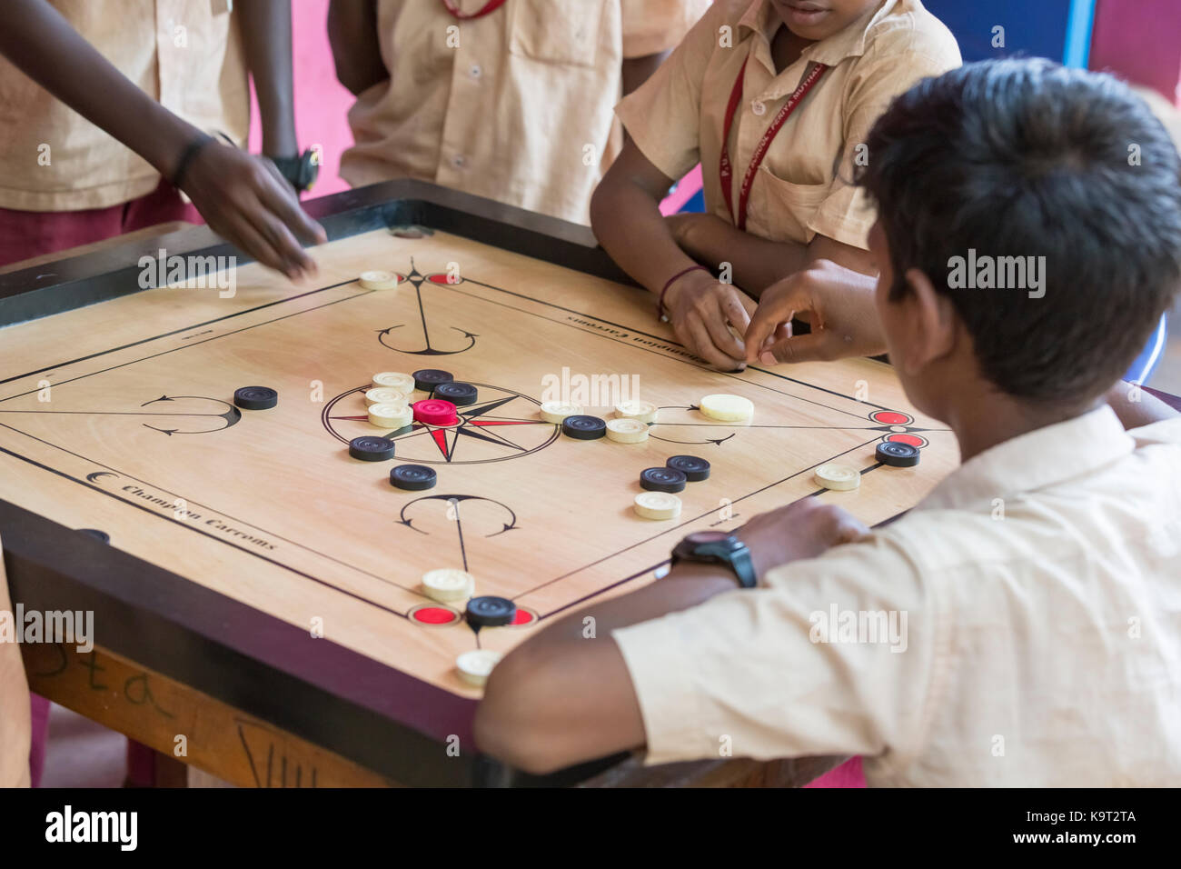 PONDICHERY, PUDUCHERY, INDIA SEPTEMBER 04, 2017. Indian children playing carrom at the table