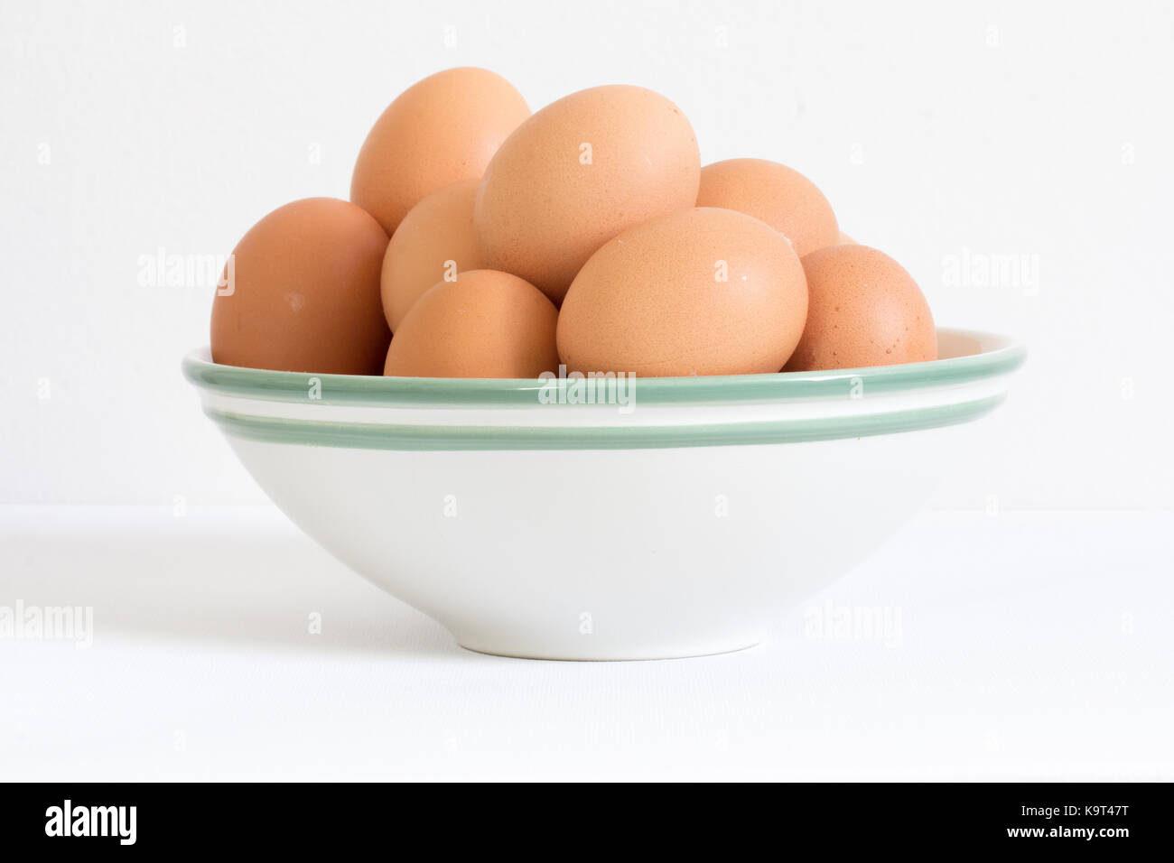 raw eggs in white bowl Stock Photo