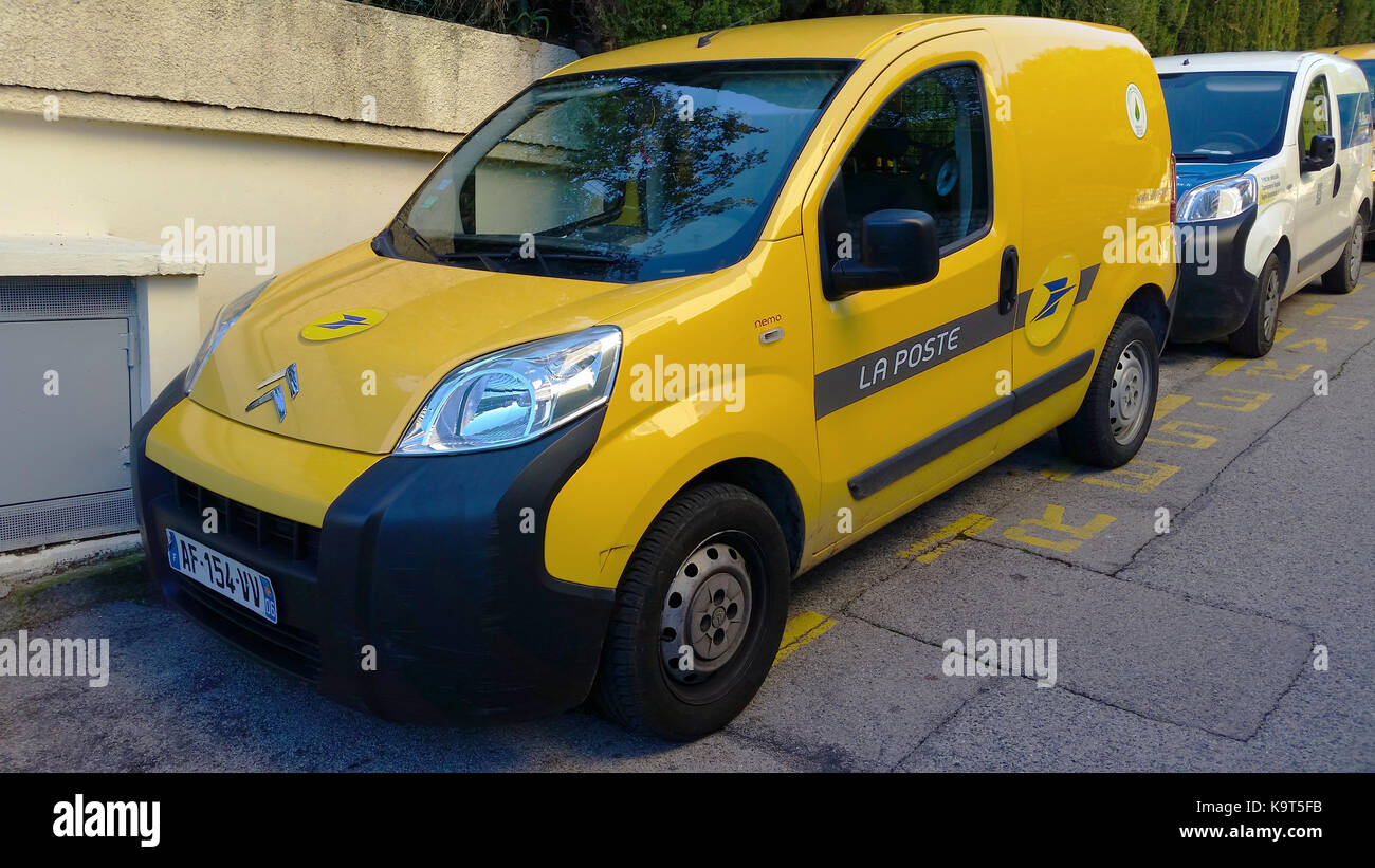 Roquebrune-Cap-Martin, France - October 30 2015: Yellow Citroen Nemo Combi, Car of the French Post Service 'La Poste', Parked Waiting to Deliver the M Stock Photo