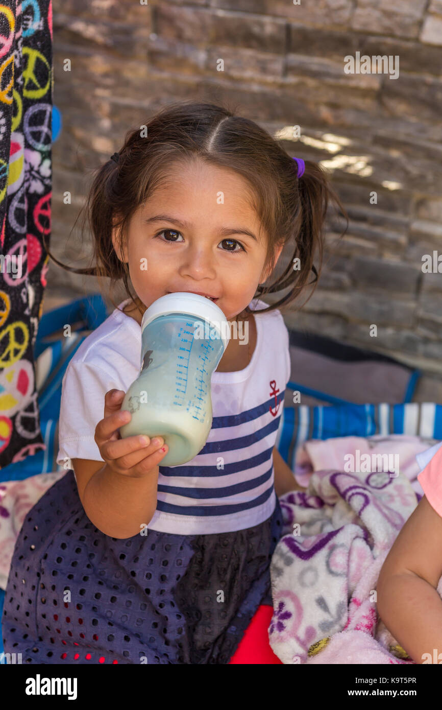 1, one, Hispanic girl, baby girl drinking from baby bottle, toddler, Castro Valley, Alameda County, California, United States, North America Stock Photo