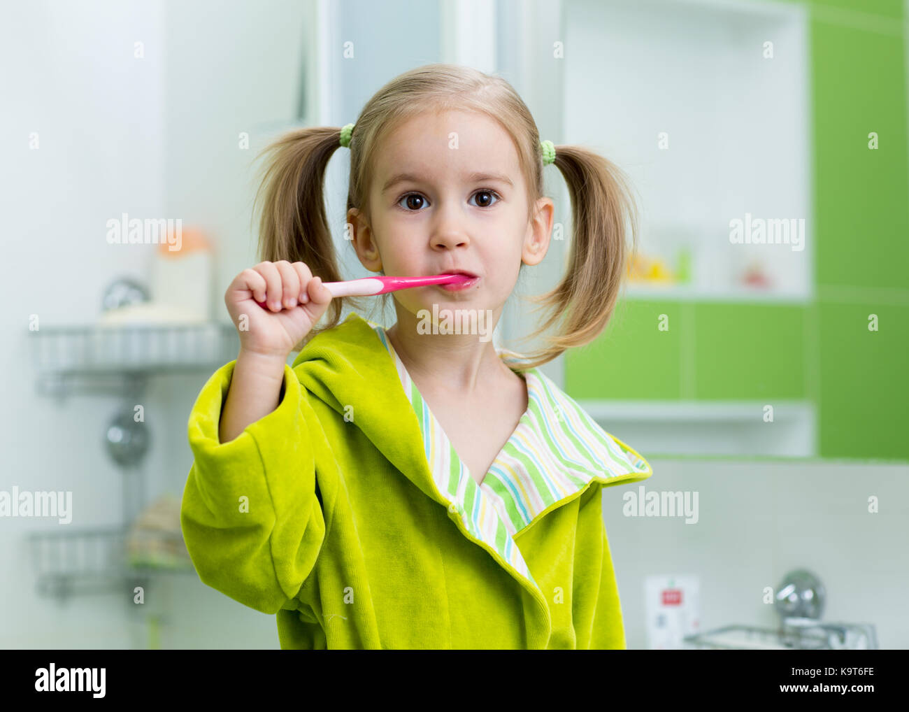 Dental care child girl cleaning her teeth Stock Photo Alamy