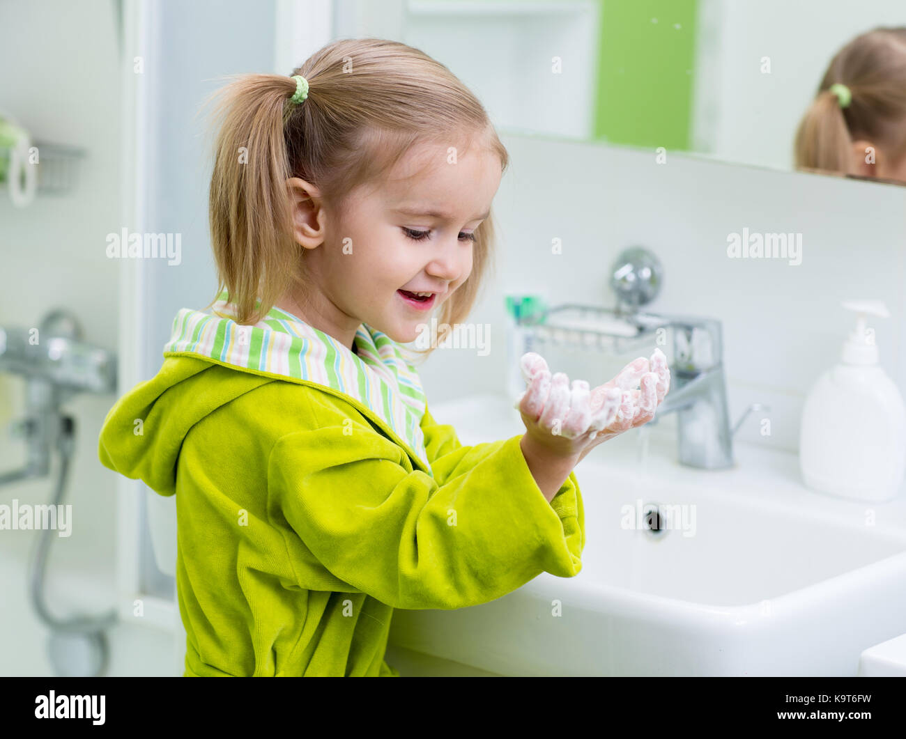 cute child washing hands in bathroom Stock Photo Alamy