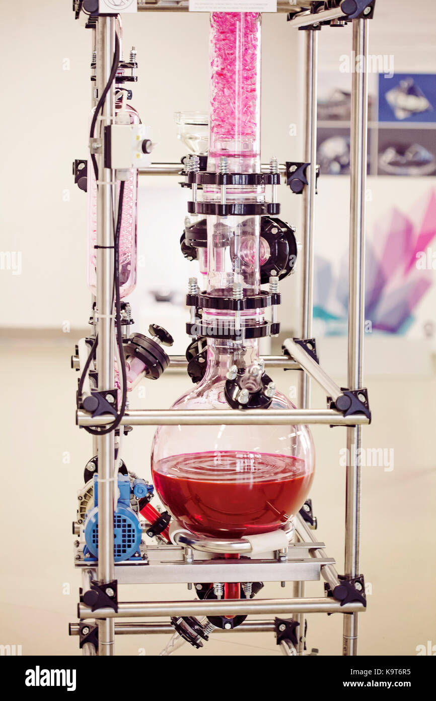 Laboratory chemical machine with moving red liquid Stock Photo - Alamy