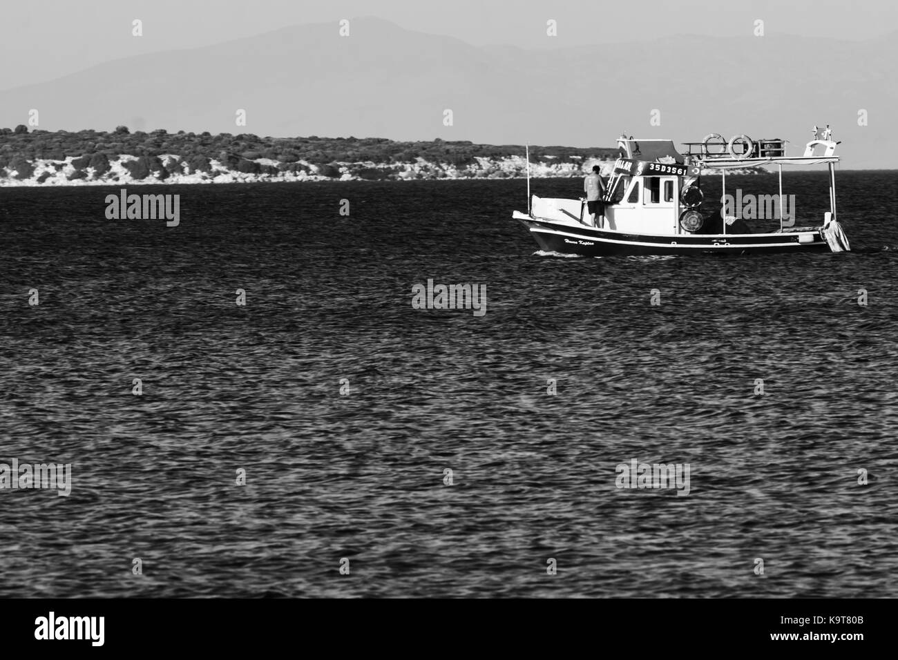 Fishing boat on the blue turkish aegean sea Stock Photo