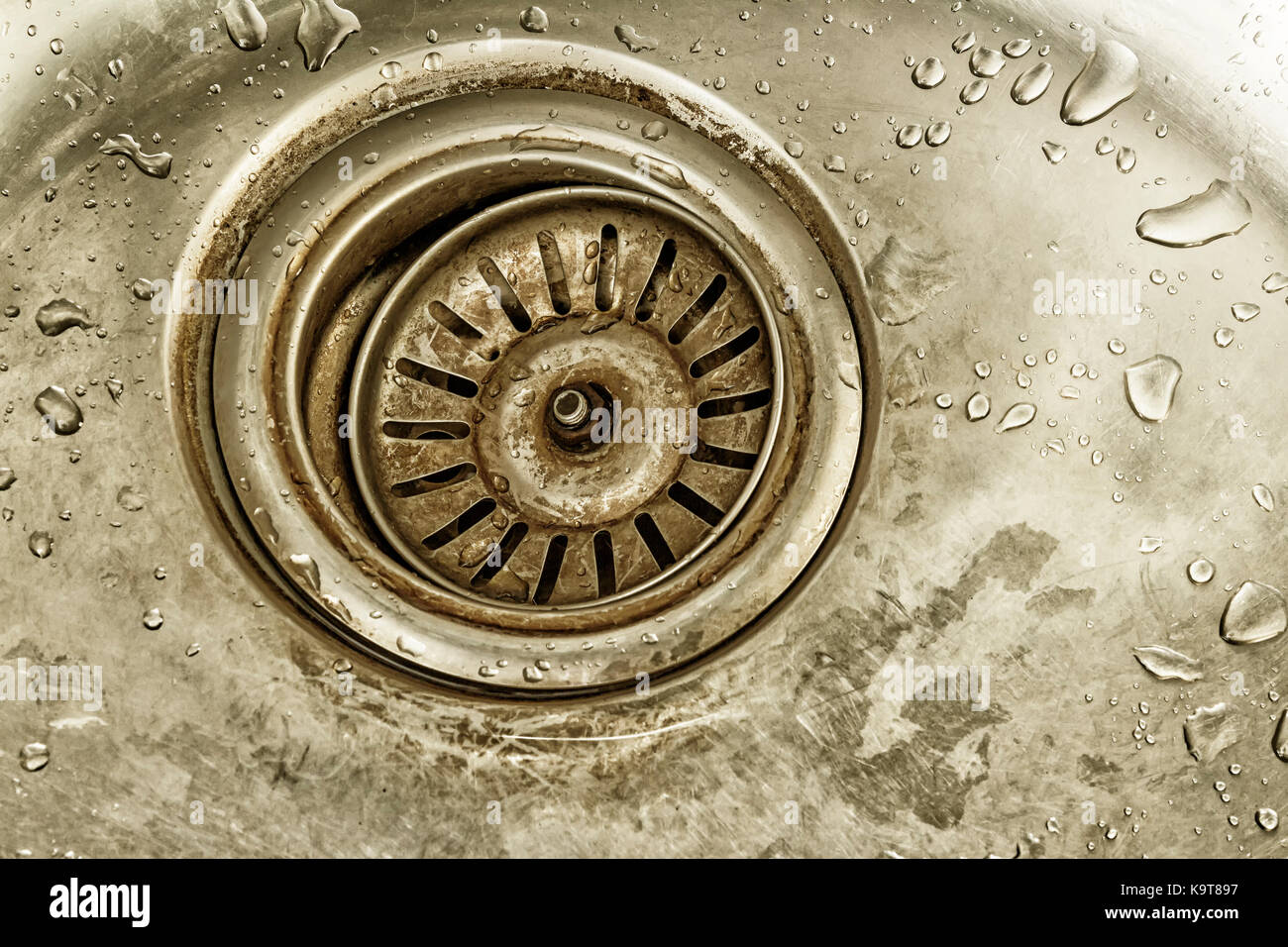 detail shot of a old dirty sink with scrubber inside.old sink,drop in