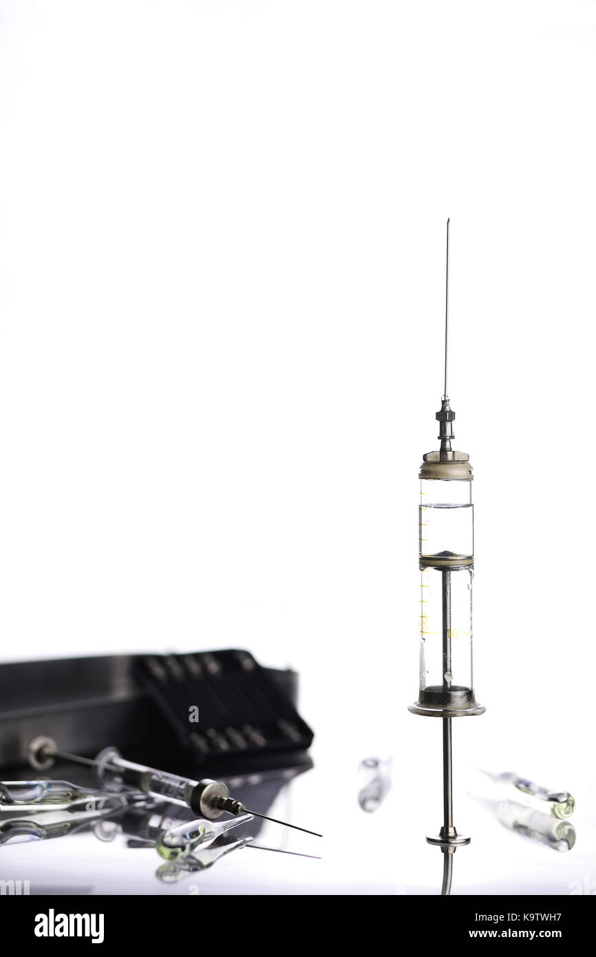 Old metal medical syringe and accessories on the table Stock Photo Alamy