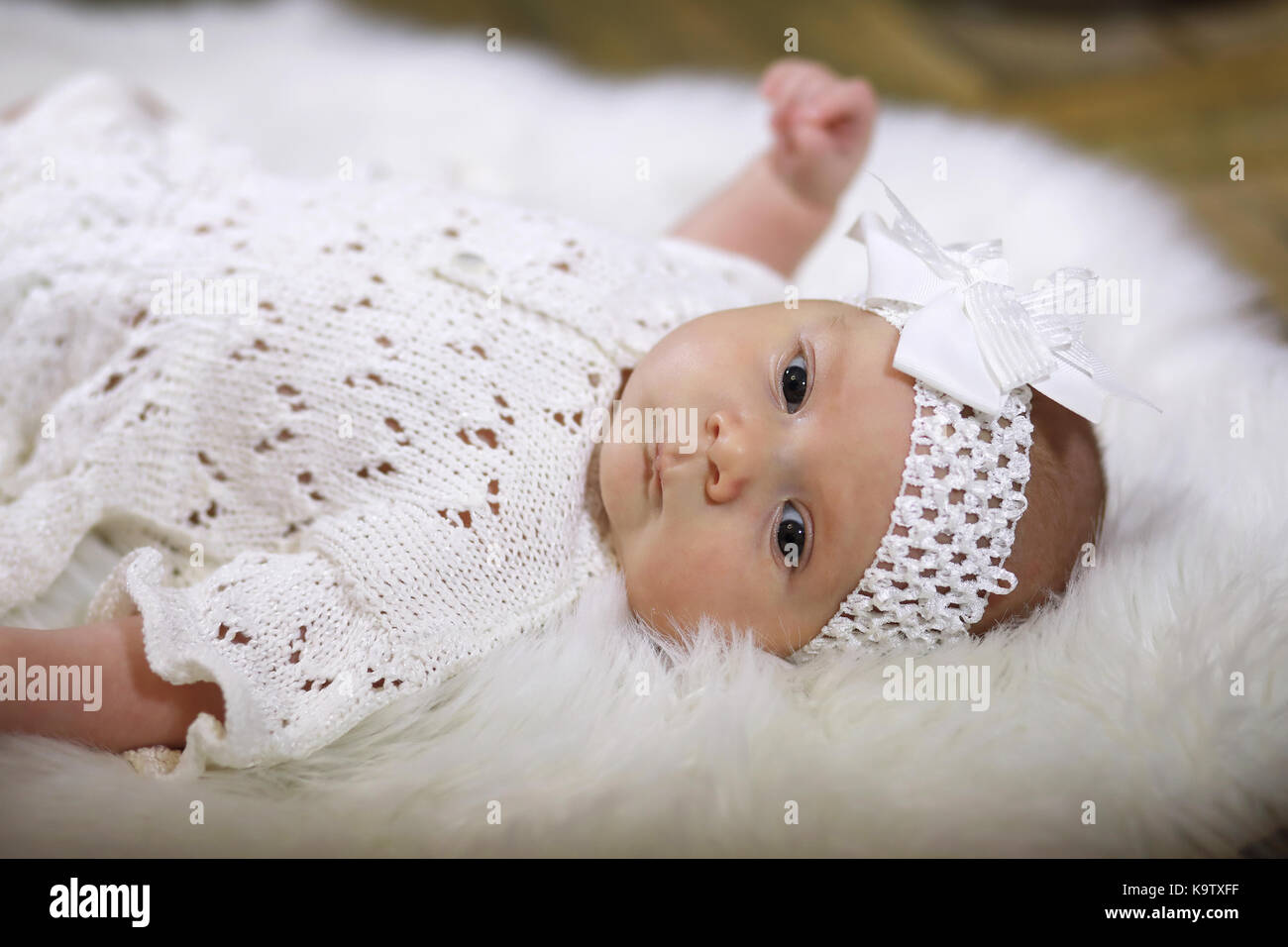 portrait of a beautiful baby girl in a white dress Stock Photo - Alamy
