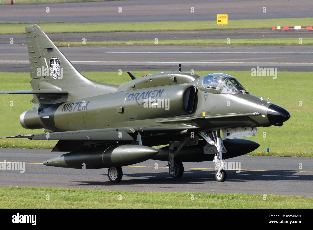 N167EM, a Douglas A-4N Skyhawk operated by Draken International's Aggressor Squadron, at Glasgow Prestwick Airport in Ayrshire. Stock Photo