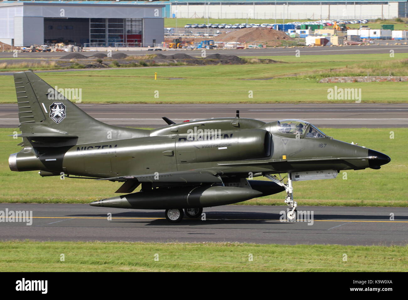 N167EM, a Douglas A-4N Skyhawk operated by Draken International's Aggressor Squadron, at Glasgow Prestwick Airport in Ayrshire. Stock Photo