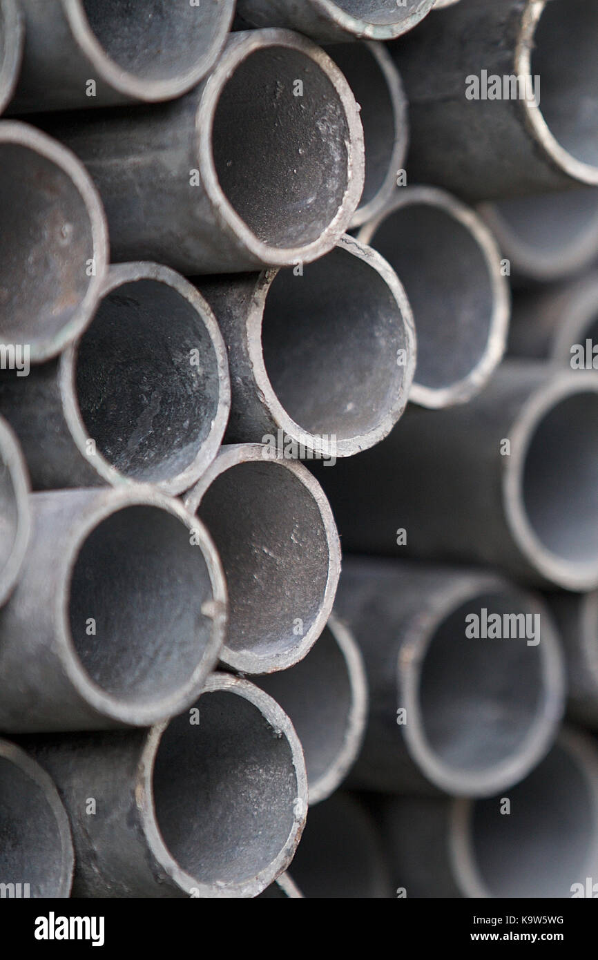 Metal profile pipe of round section in packs at the warehouse of metal ...