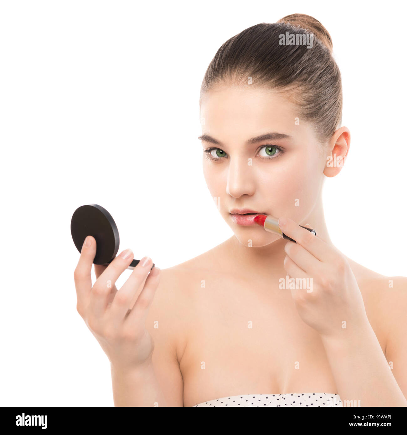 Teen girl applying lipstick hi-res stock photography and images - Alamy