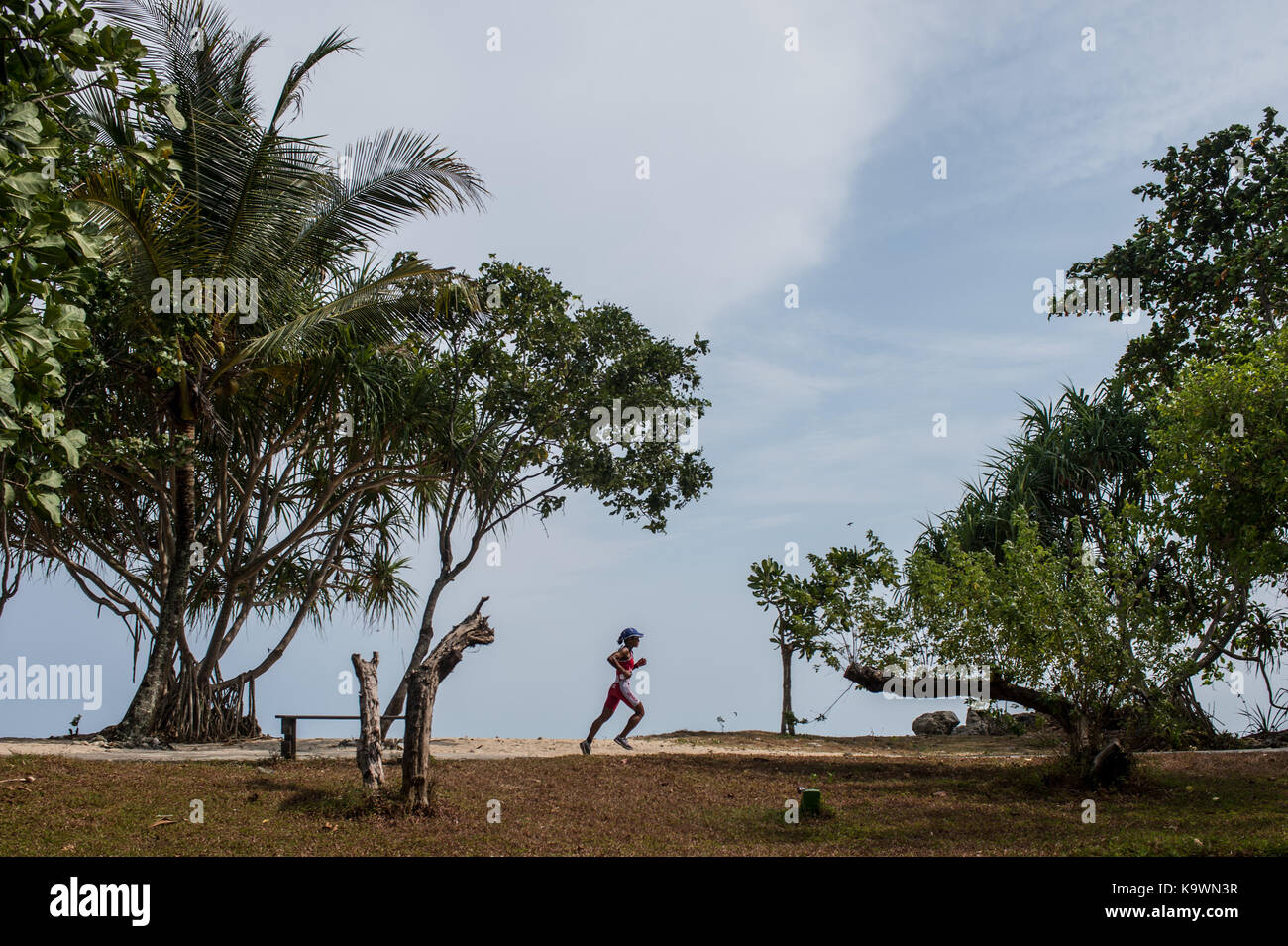 Pandeglang, Banten Province in Indonesia. 24th Sep, 2017. A female participant runs during Cross Triathlon competition at Tanjung Lesung, Pandeglang District, Banten Province in Indonesia, Sept. 24, 2017. Credit: Veri Sanovri/Xinhua/Alamy Live News Stock Photo