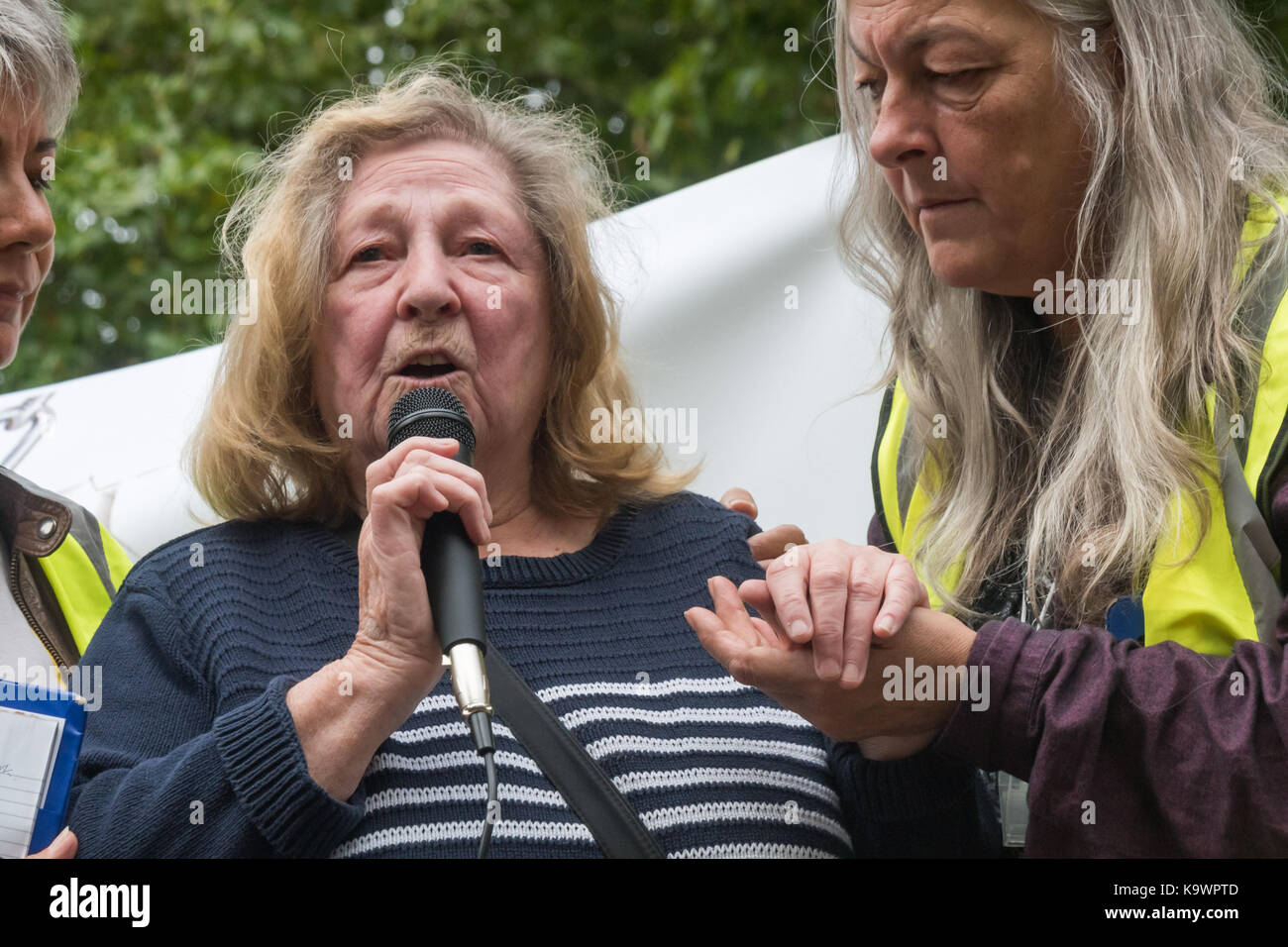 London, UK. 23rd Sep, 2017. London, UK. 23rd September 2017. Lynne, a home owner in the Northumberalnd Park Estate is steadied byu stewards as she tells the horrendous story of her treatment by Haringey COuncil at the rally in Tottenham before the march to Finsbury Park against the so called Haringey Development Vehicle, under which Haringey Council is making a huge transfer of council housing to Australian multinational Lendlease. This will result in the imminent demolition of over 1,300 council homes on the Northumberland Park estate, followed by similar loss of social housing across t Stock Photo