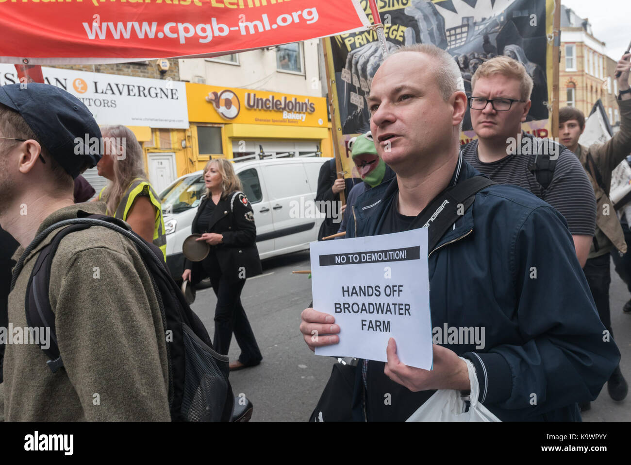 London, UK. 23rd Sep, 2017. London, UK. 23rd September 2017.A Broadwater Farm resident holds a poster on the march in North London from a rally in Tottenham to Finsbury Park against the so called Haringey Development Vehicle, under which Haringey Council is making a huge transfer of council housing to Australian multinational Lendlease. This will result in the imminent demolition of over 1,300 council homes on the Northumberland Park estate, followed by similar loss of social housing across the whole of the borough. At Â£2 billion, his is the largest giveaway of council housing and asset Stock Photo