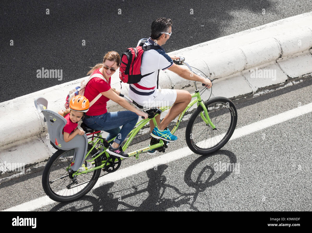 Family riding Tandem bicycle Stock Photo Alamy