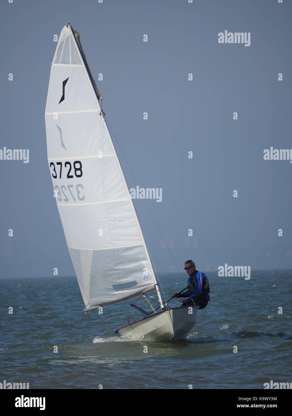 A solo class sailing dinghy on a sunny day Stock Photo - Alamy