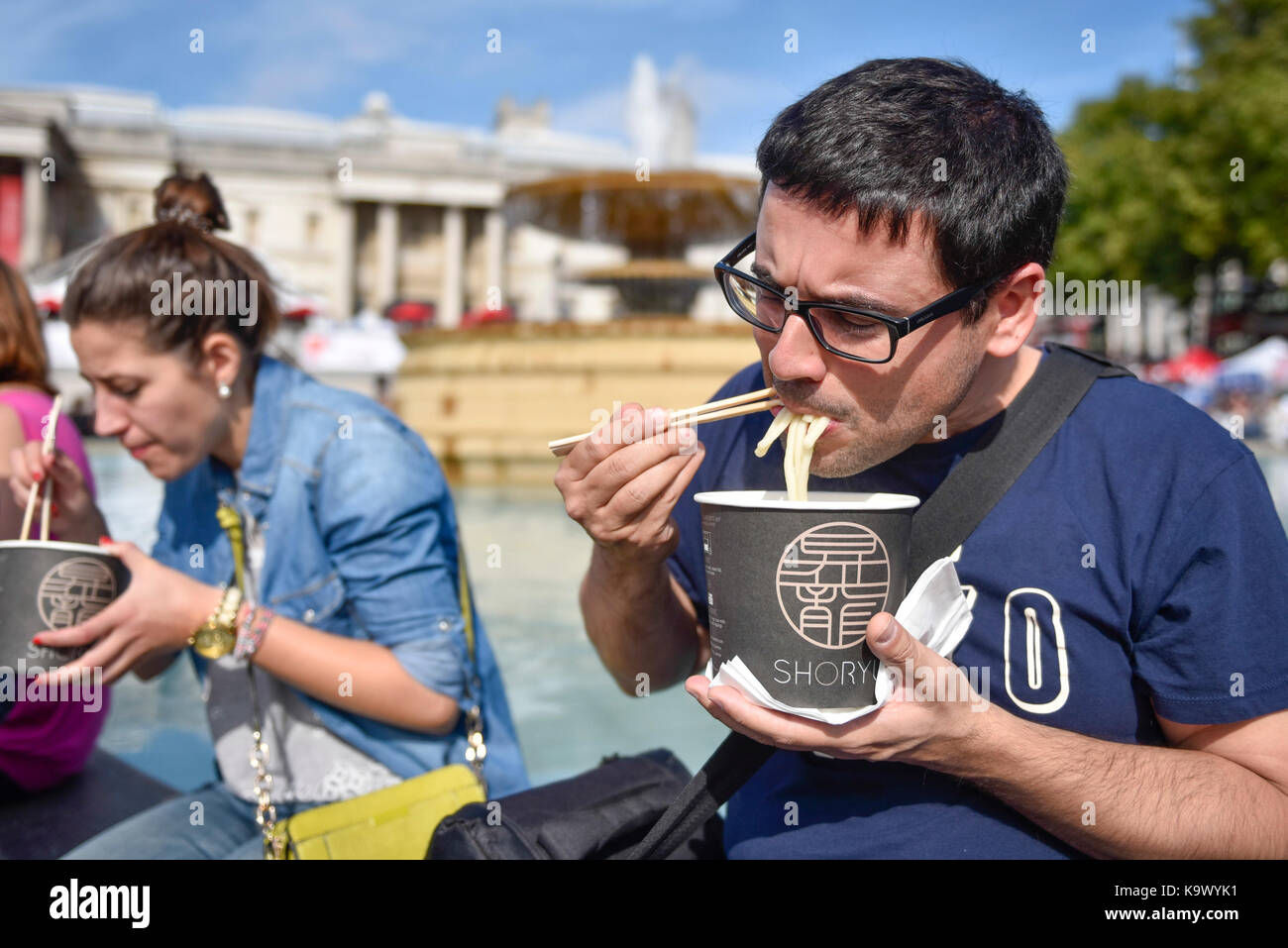 London, UK. 24 September 2017. Visitors enjoy eating udon noodles
