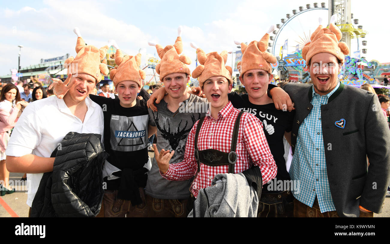 Munich, Germany. 23rd Sep, 2017. Drunken visitors at the Oktoberfest entertain themselves with vast amounts of beer in Munich, Germany, 23 September 2017. Credit: Felix Hörhager/dpa/Alamy Live News Stock Photo