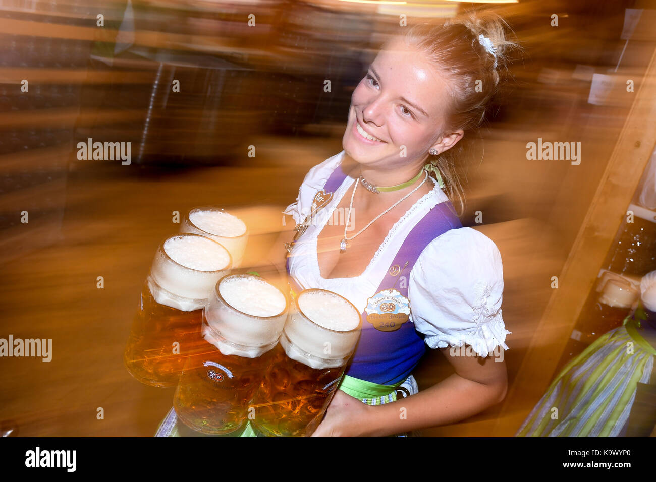 Munich, Germany. 24th Sep, 2017. Drunken visitors at the Oktoberfest consume vast amounts of beer in Munich, Germany, 24 September 2017. Credit: Tobias Hase/dpa/Alamy Live News Stock Photo