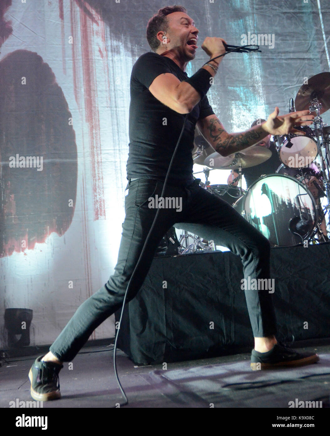 Minneapolis, Minnesota, USA. 23rd Sep, 2017. Lead singer Tim McIlrath of the band Rise Against performs at the Skyway Theatre in Minneapolis, Minnesota. Ricky Bassman/CSM/Alamy Live News Stock Photo