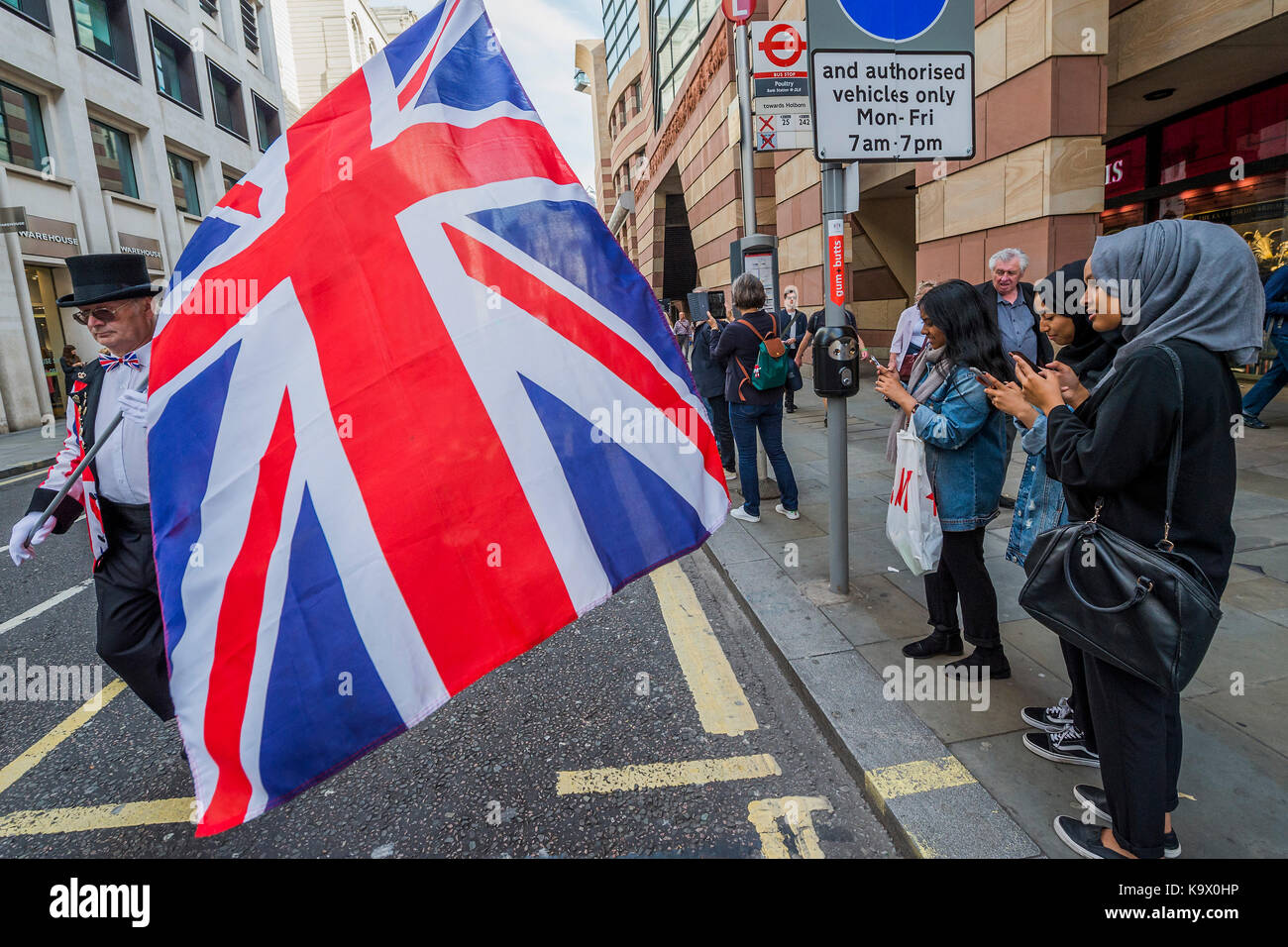 London, UK. 24th September, 2017. Marching to St Mary Le Bow Church - The annual Harvest Festival organised by the Pearly Society starts with a ceremony in Guild hall courtyard and then processes to Bow Church in the City of London. Pearly Kings and Queens of London get together for the biggest event in the Pearly calendar. London 24 Sep 2017. Credit: Guy Bell/Alamy Live News Stock Photo