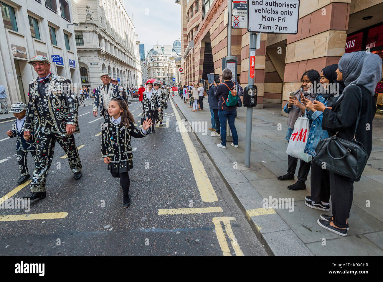 London, UK. 24th September, 2017. Marching to St Mary Le Bow Church - The annual Harvest Festival organised by the Pearly Society starts with a ceremony in Guild hall courtyard and then processes to Bow Church in the City of London. Pearly Kings and Queens of London get together for the biggest event in the Pearly calendar. London 24 Sep 2017. Credit: Guy Bell/Alamy Live News Stock Photo