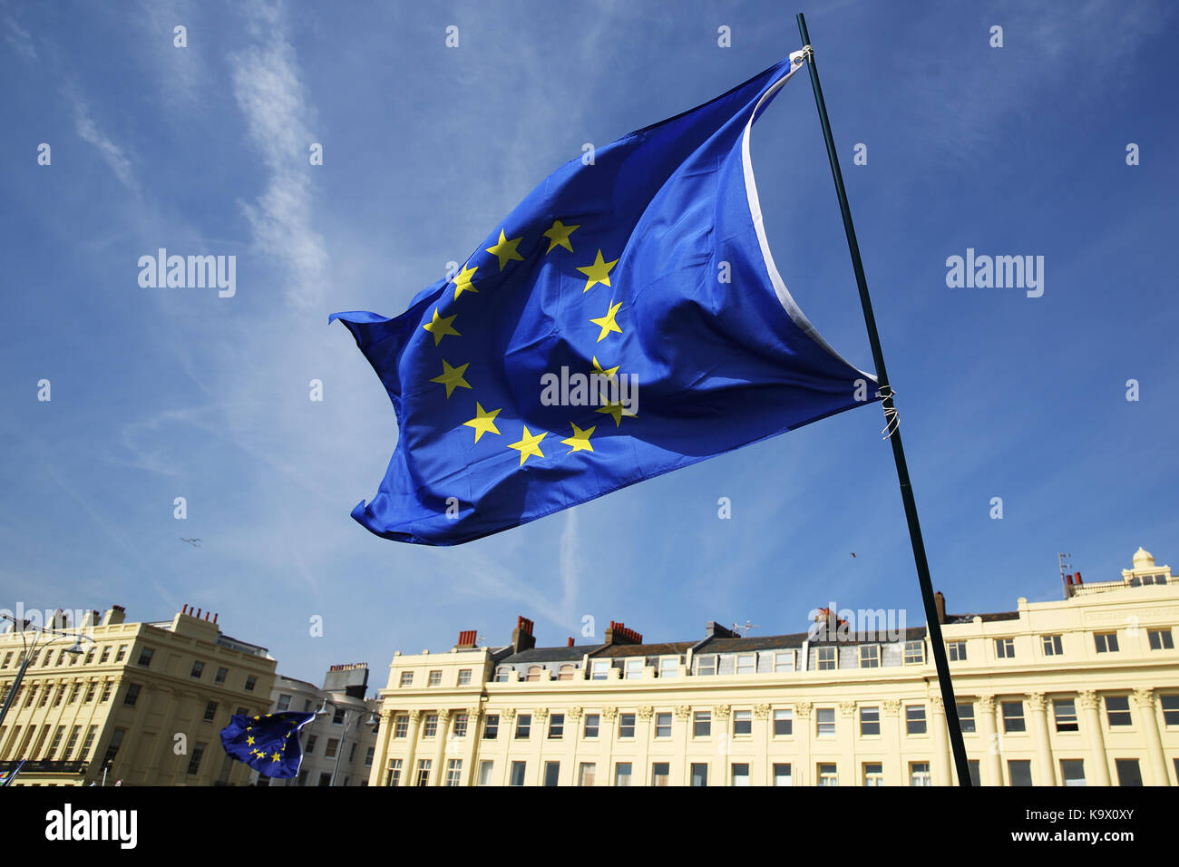 Brighton, UK. 24th September, 2017. A Pro European Union supporters waves the EU flag during a protest against Brexit in Brighton, UK, Sunday, September 24, 2017. Protesters rallied outside the annual Labour Party Conference being held in Brighton and attended by the opposition leader Jeremy Corbyn. Photograph : Credit: Luke MacGregor/Alamy Live News Stock Photo