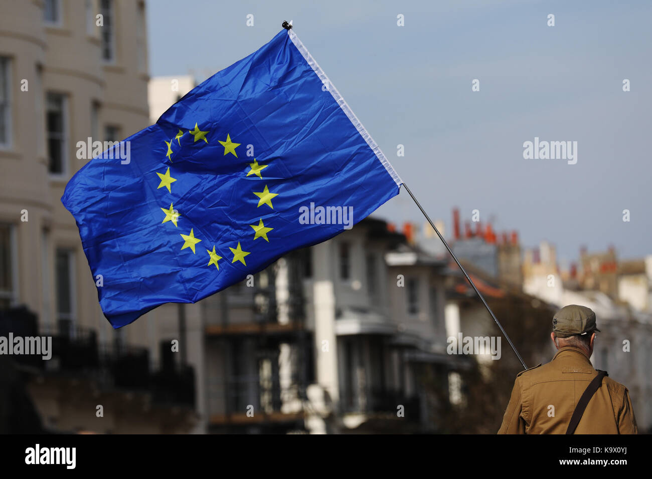 Brighton, UK. 24th September, 2017. A Pro European Union supporter waves an EU flag during a protest against Brexit in Brighton, UK, Sunday, September 24, 2017. Protesters rallied outside the annual Labour Party Conference being held in Brighton and attended by the opposition leader Jeremy Corbyn. Photograph : Credit: Luke MacGregor/Alamy Live News Stock Photo