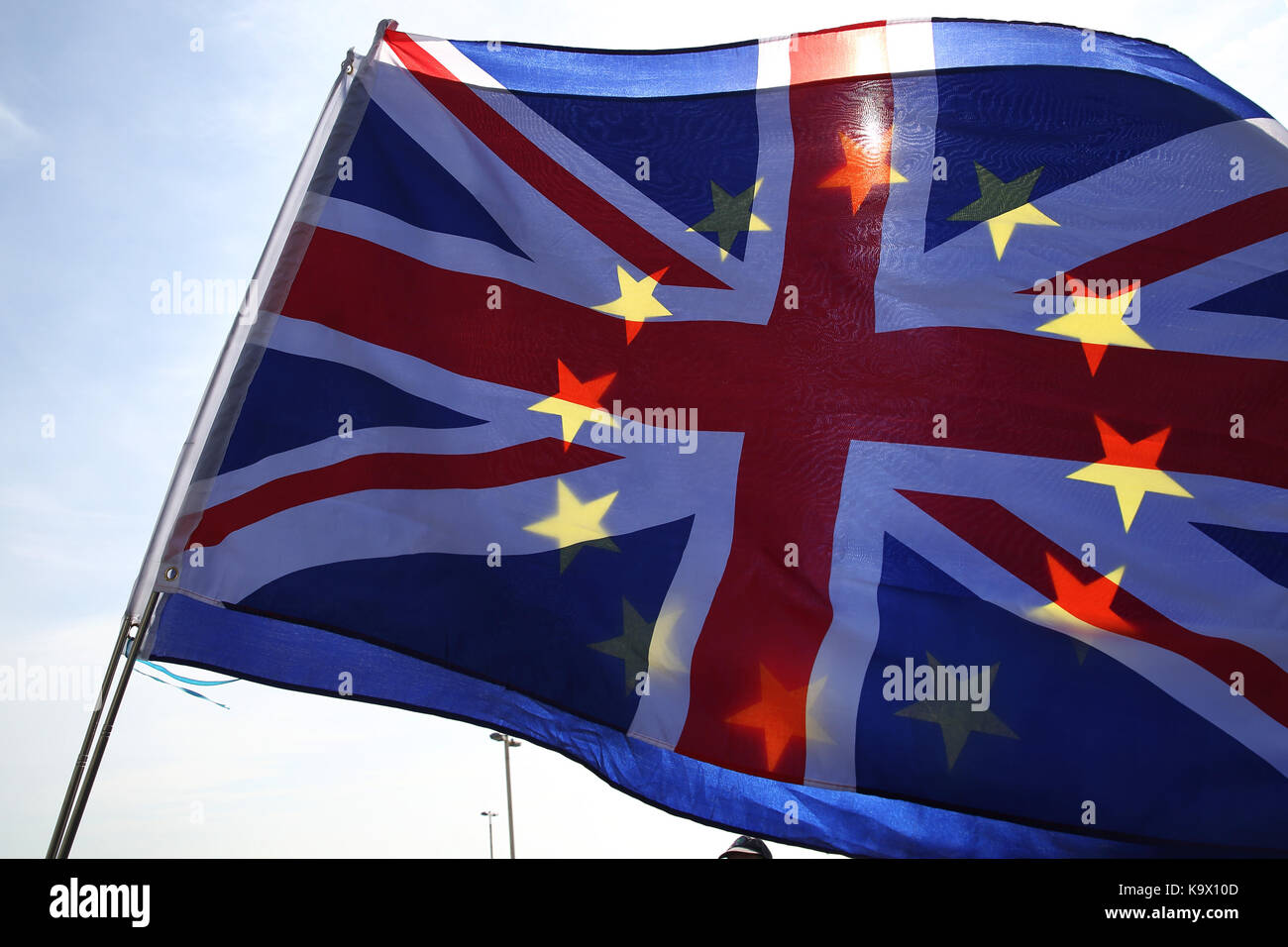 Brighton, UK. 24th September, 2017. Light shines through the European Union and Union Jack flags during a pro European Union protest against Brexit in Brighton, UK, Sunday, September 24, 2017. Protesters rallied outside the annual Labour Party Conference being held in Brighton and attended by the opposition leader Jeremy Corbyn. Photograph : Credit: Luke MacGregor/Alamy Live News Stock Photo