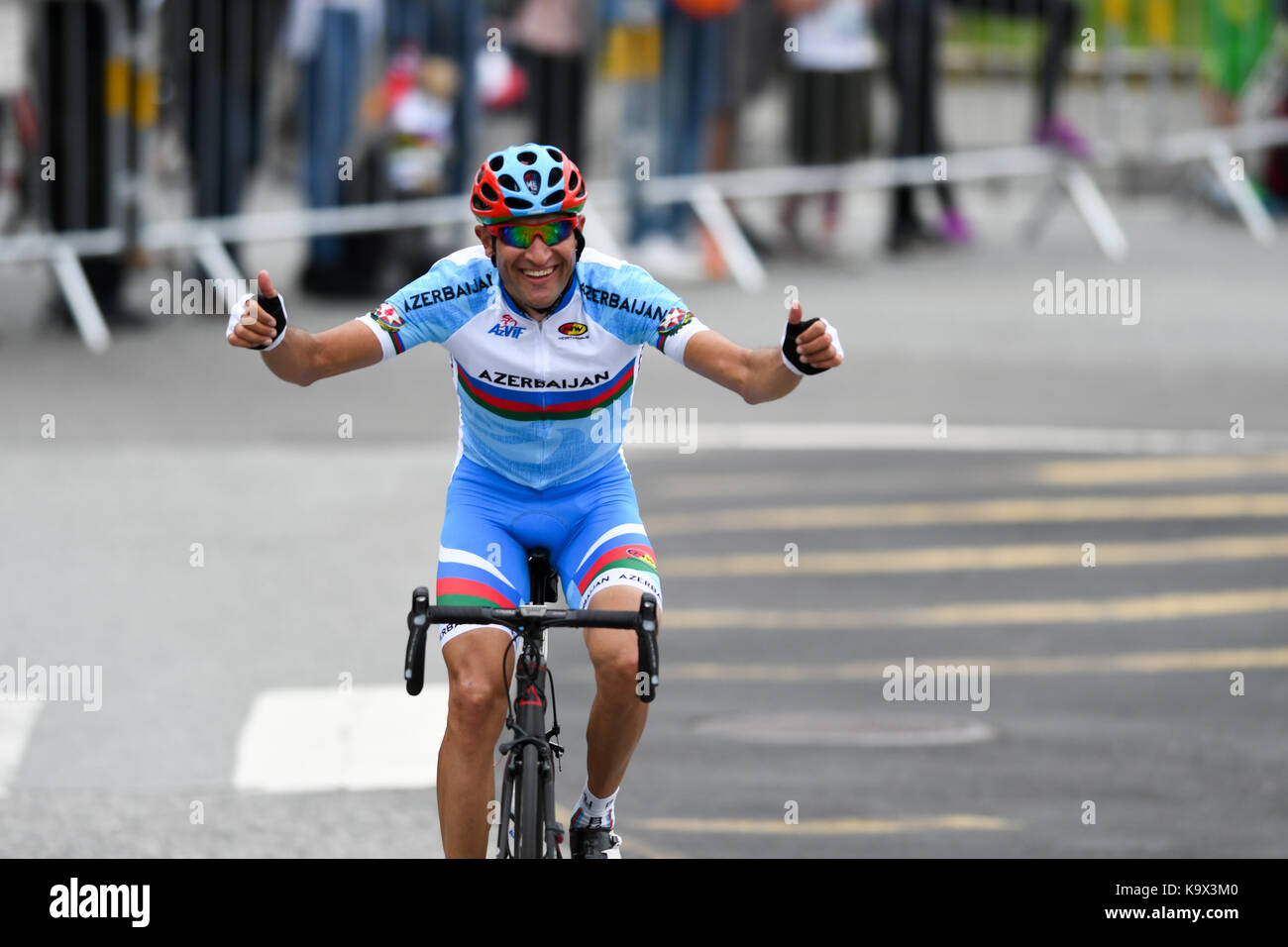 Bergen, Norway. 24th September, 2017. Elchin Asadov (Azerbaijan) was part of the early ten men breakway group. As the group got reeled in and the breakaway riders struggled with the peloton pace, and got dropped. Elchin Asadov was still all smiles and thanked the specatators along the course, before he abandoned the race for a DNF. Credit: Kjell Eirik Irgens Henanger/Alamy Live News Stock Photo