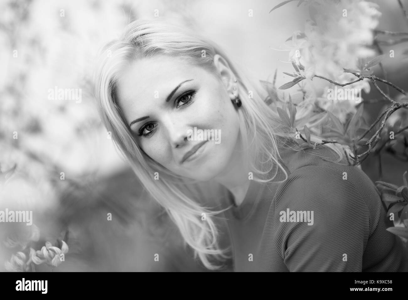 Young woman wearing white top Black and White Stock Photos & Images - Alamy