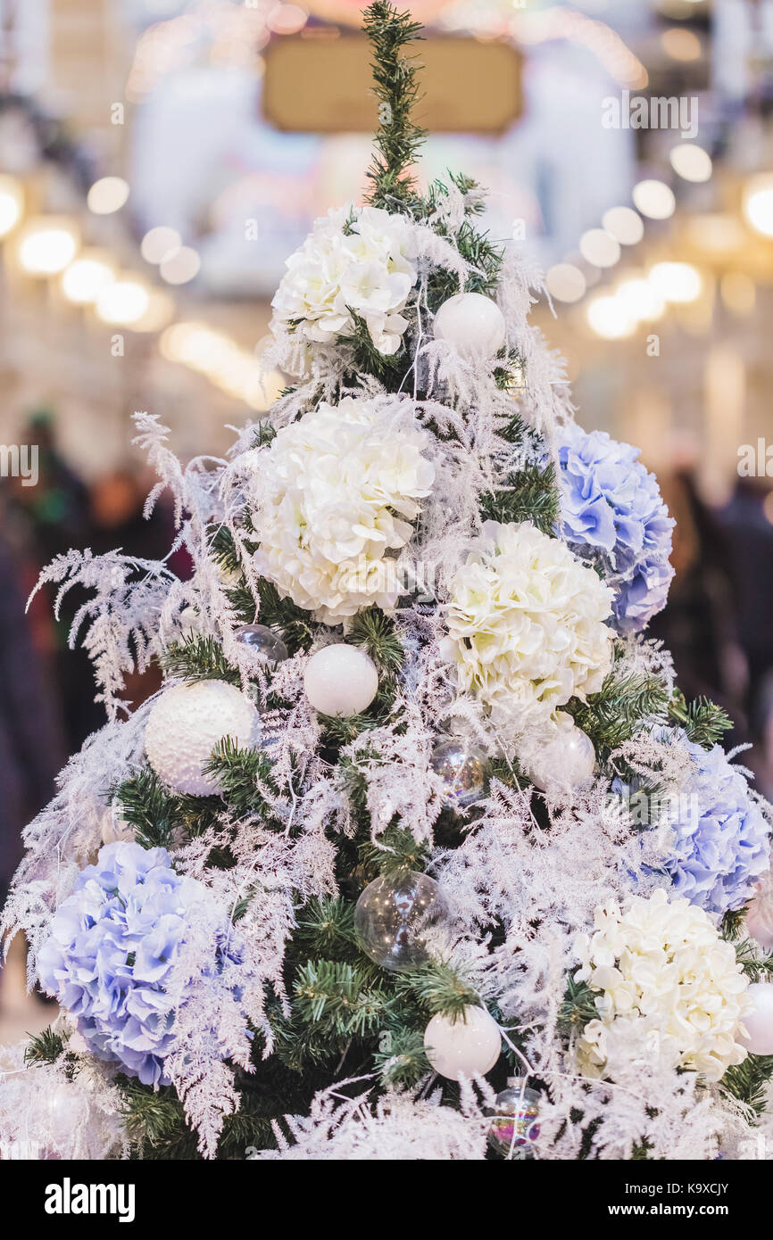Unusual Christmas tree decoration with hydrangea flowers Stock Photo