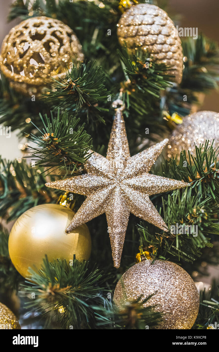 Christmas tree decorations in gold tones with lots of beautiful shiny