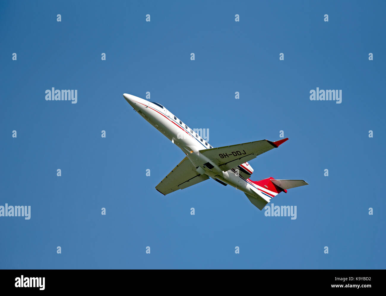 Learjet 75 Luxury business aircraft departing from iNVERNESS in the Scottish Highlands. Stock Photo