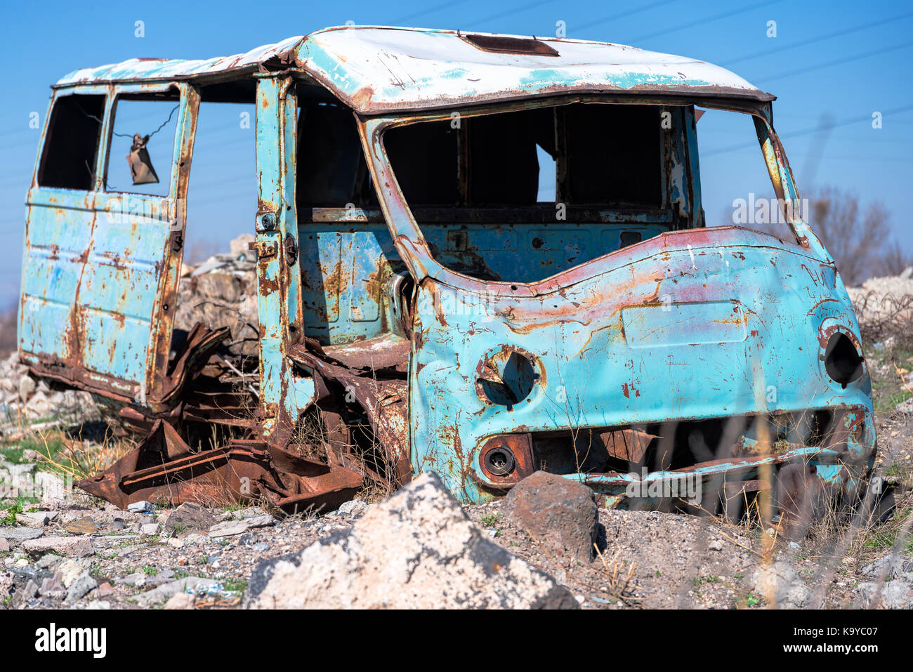 Rusty, old and abandoned Soviet Russian van out in the wasteland in rural Southern Armenia in Ararat province on 4 April 2017. Stock Photo